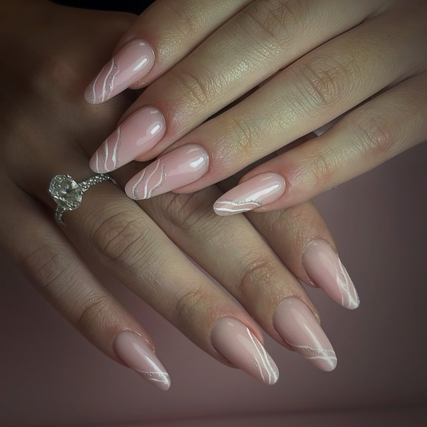 21. Blush Nude Almond Nails with White Swirl and Silver Glitter Detail - elegant bridal nail ideas