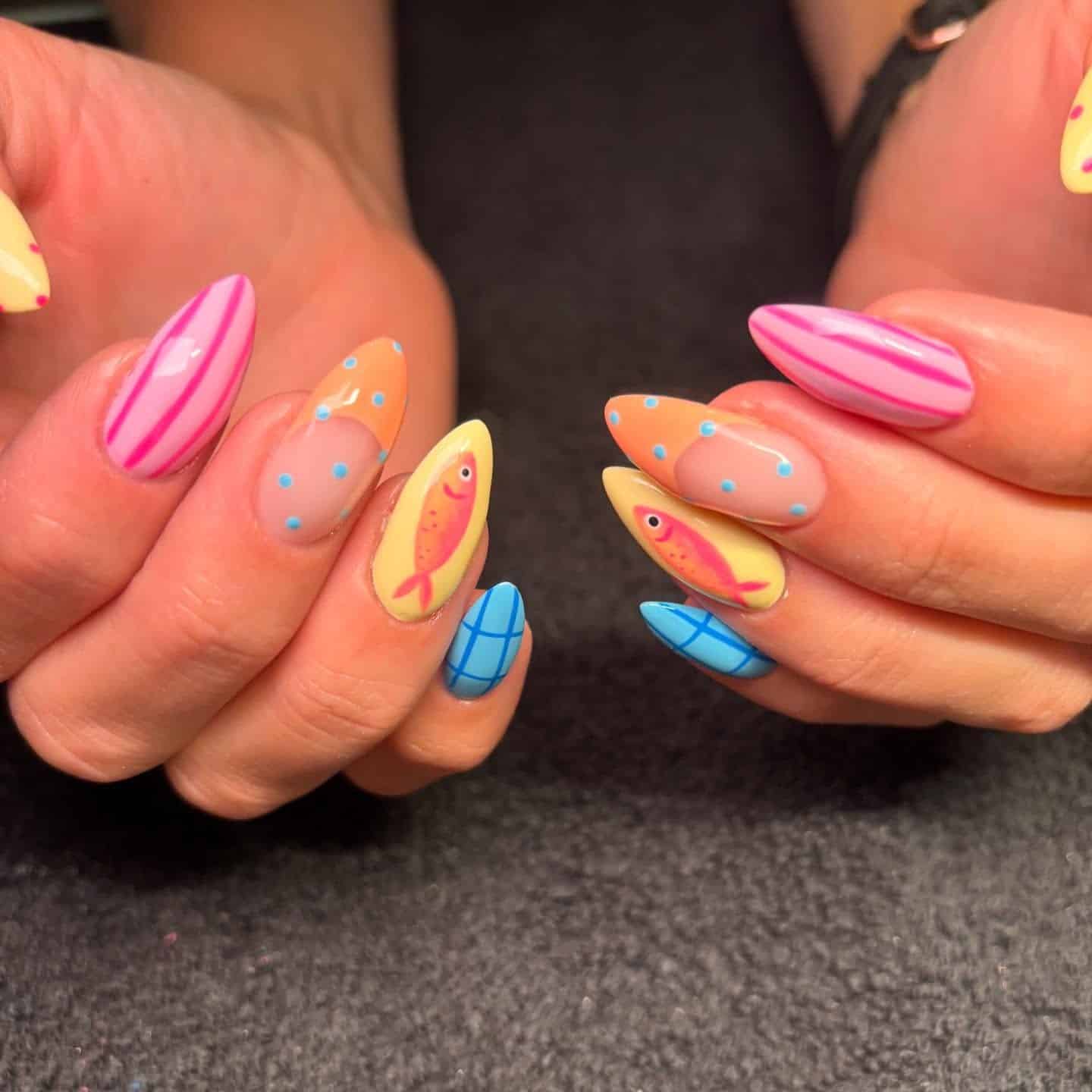9. Pastel Graphic Fish & Pattern Mix Nails - fish nail ideas