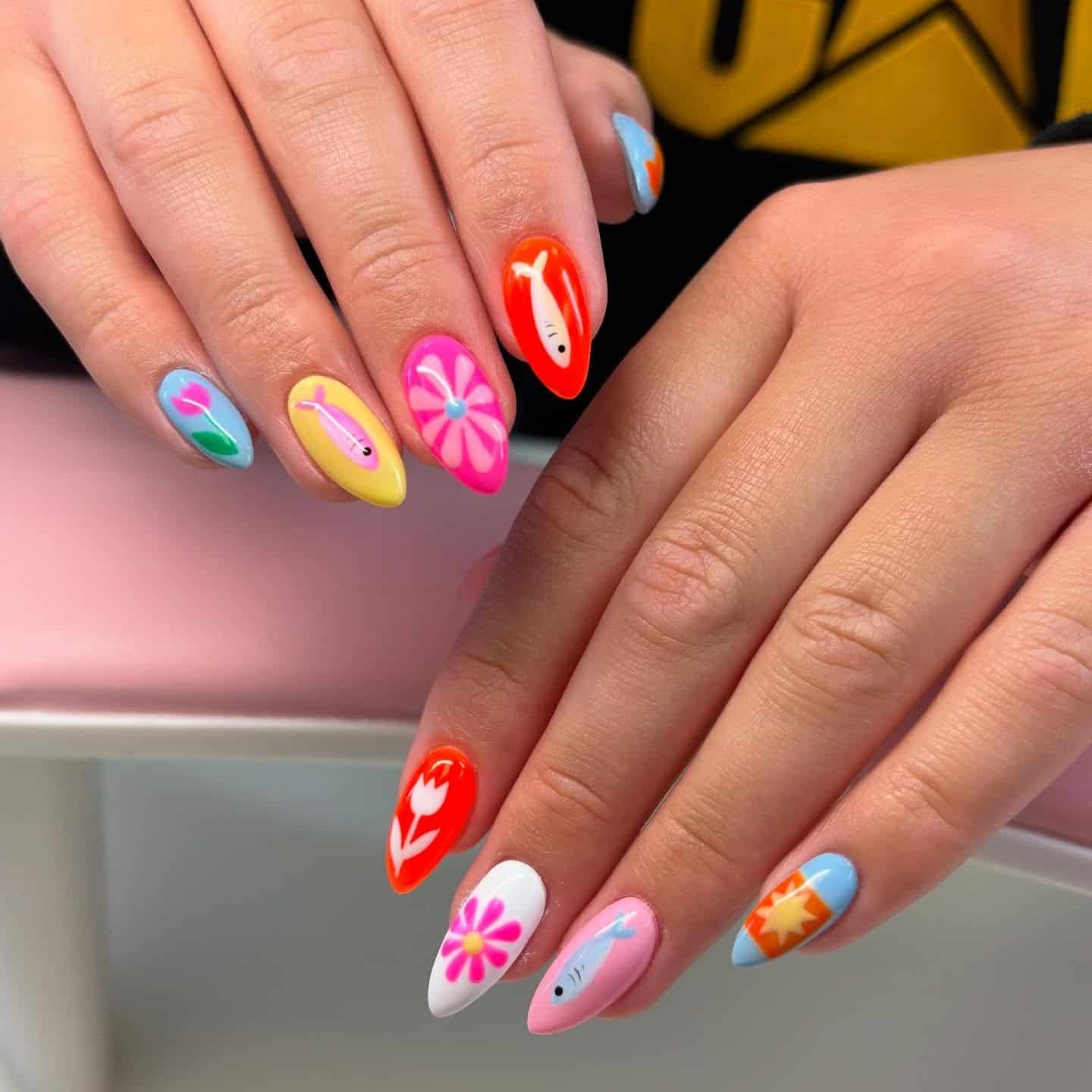 10. Bright Floral & Fish Art Almond Nails - fish nail ideas