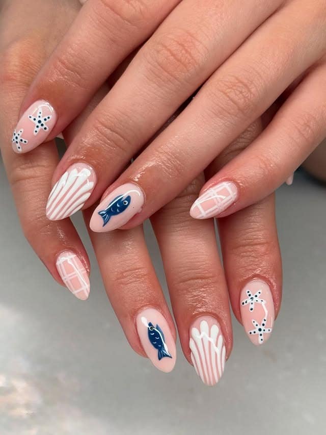 14. Nude Almond Nails with Navy Fish and Shell Art - fish nail ideas