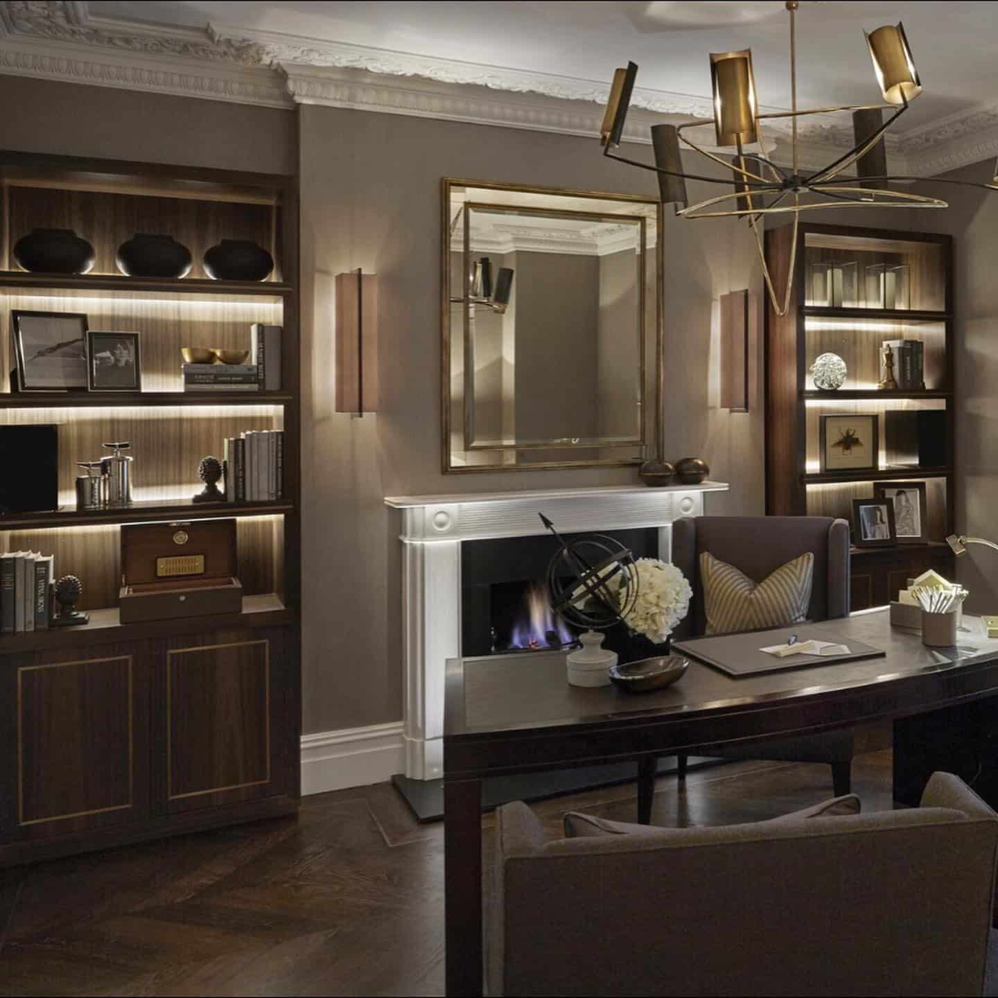 6. Classic Gentleman’s Office with Fireplace & Brass Lighting - masculine home office ideas