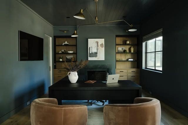 8. Forest Green Study with Minimalist Black Desk - masculine home office ideas