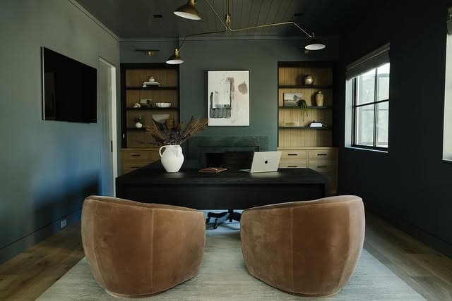 17. Moody Green Study with Tan Barrel Chairs - masculine home office ideas