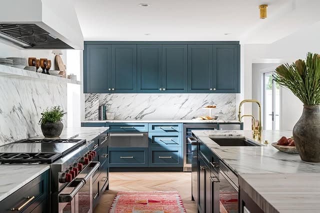 12. Deep Teal Cabinets with Marble Backsplash - dark cabinets kitchen ideas