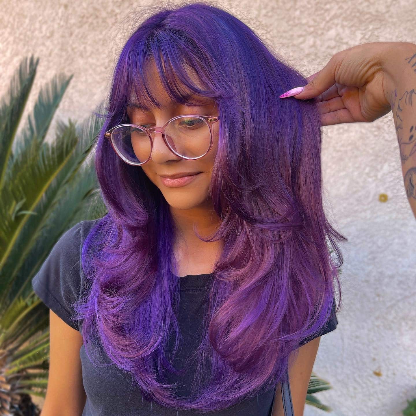 14. Violet Rose Layered Cut with Curtain Bangs - Purple Hair Color