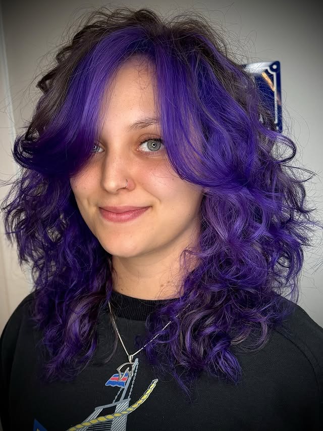 22. Electric Indigo Curly Shag - Purple Hair Color