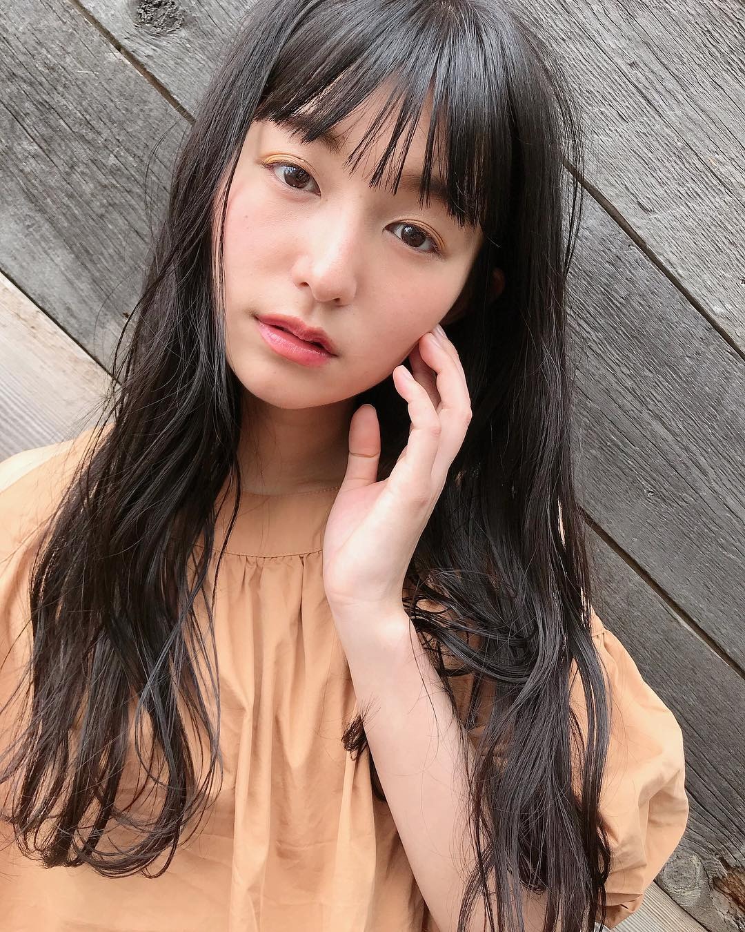 16. Sleek Onyx Waves with Wispy Fringe - Long Wave Hairstyles