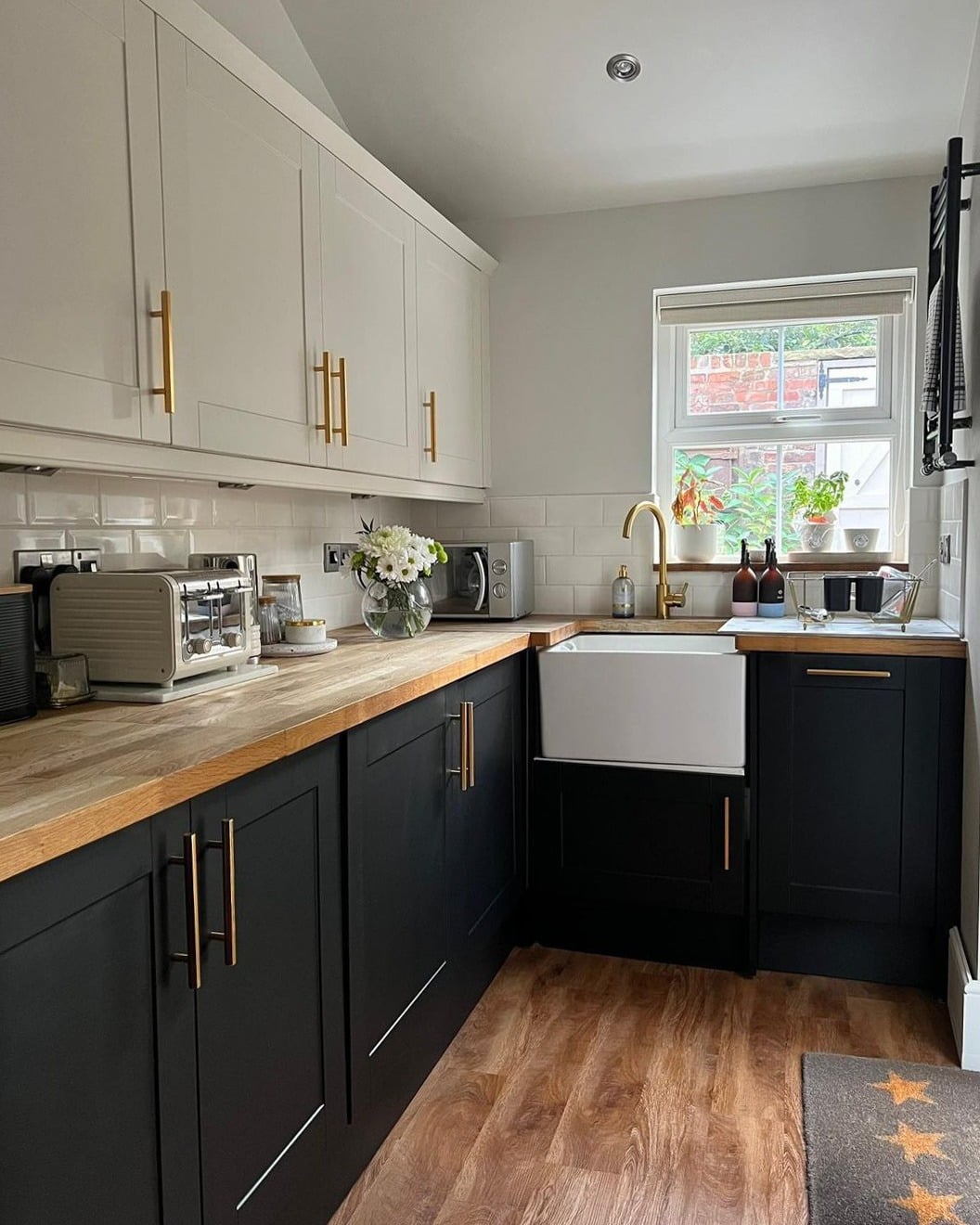 7. Two-Tone Black and White Galley Kitchen - black cabinets kitchen ideas