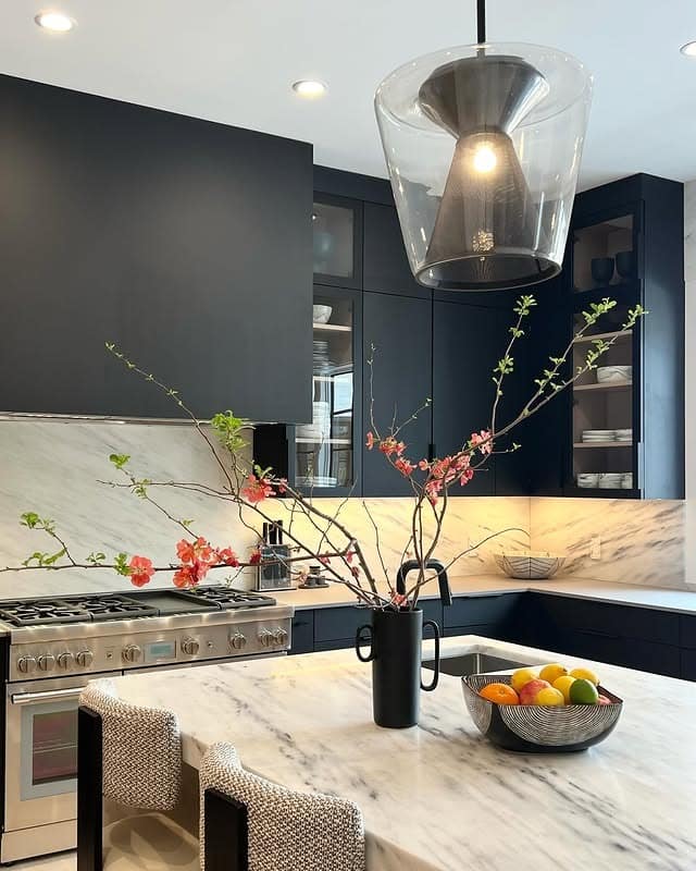 11. Matte Black Cabinets with Marble Waterfall Island - black cabinets kitchen ideas