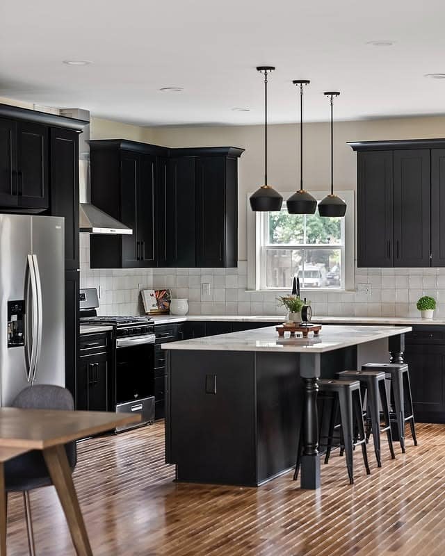 17. Black Cabinets with White Tile and Central Island - black cabinets kitchen ideas