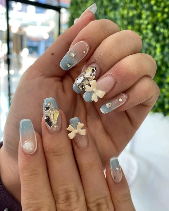 16. Dusty Blue Ombre Coffin with Bow Charms - formal nail ideas