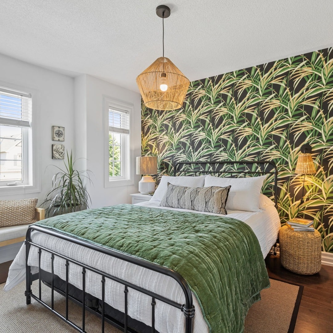 7. Bold Palm Accent Wall in Emerald and Black - tropical bedroom ideas