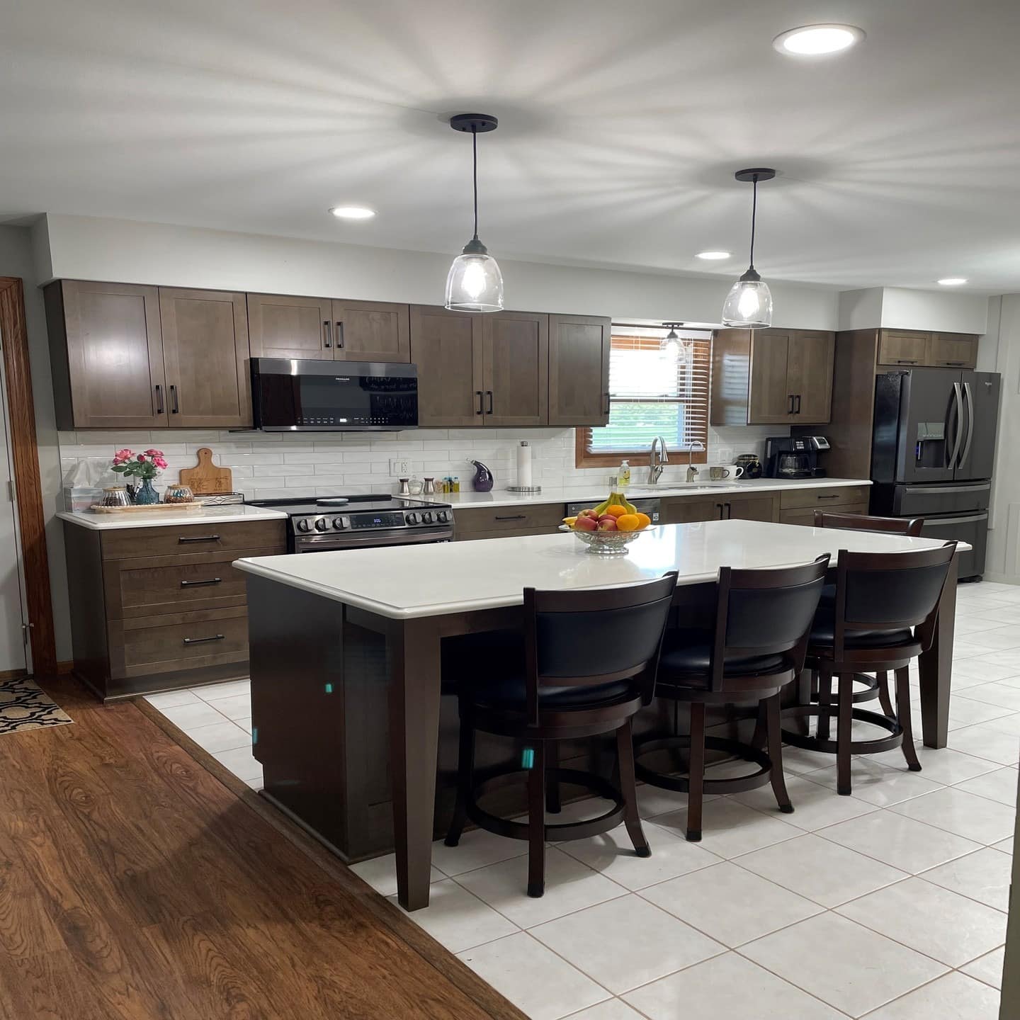 3. Mid-Tone Brown Shaker Cabinets with Bright Island Contrast - brown kitchen cabinets ideas