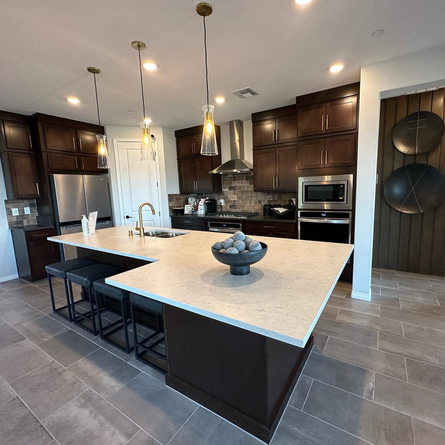 4. Deep Chocolate Cabinets with Contemporary Lighting - brown kitchen cabinets ideas