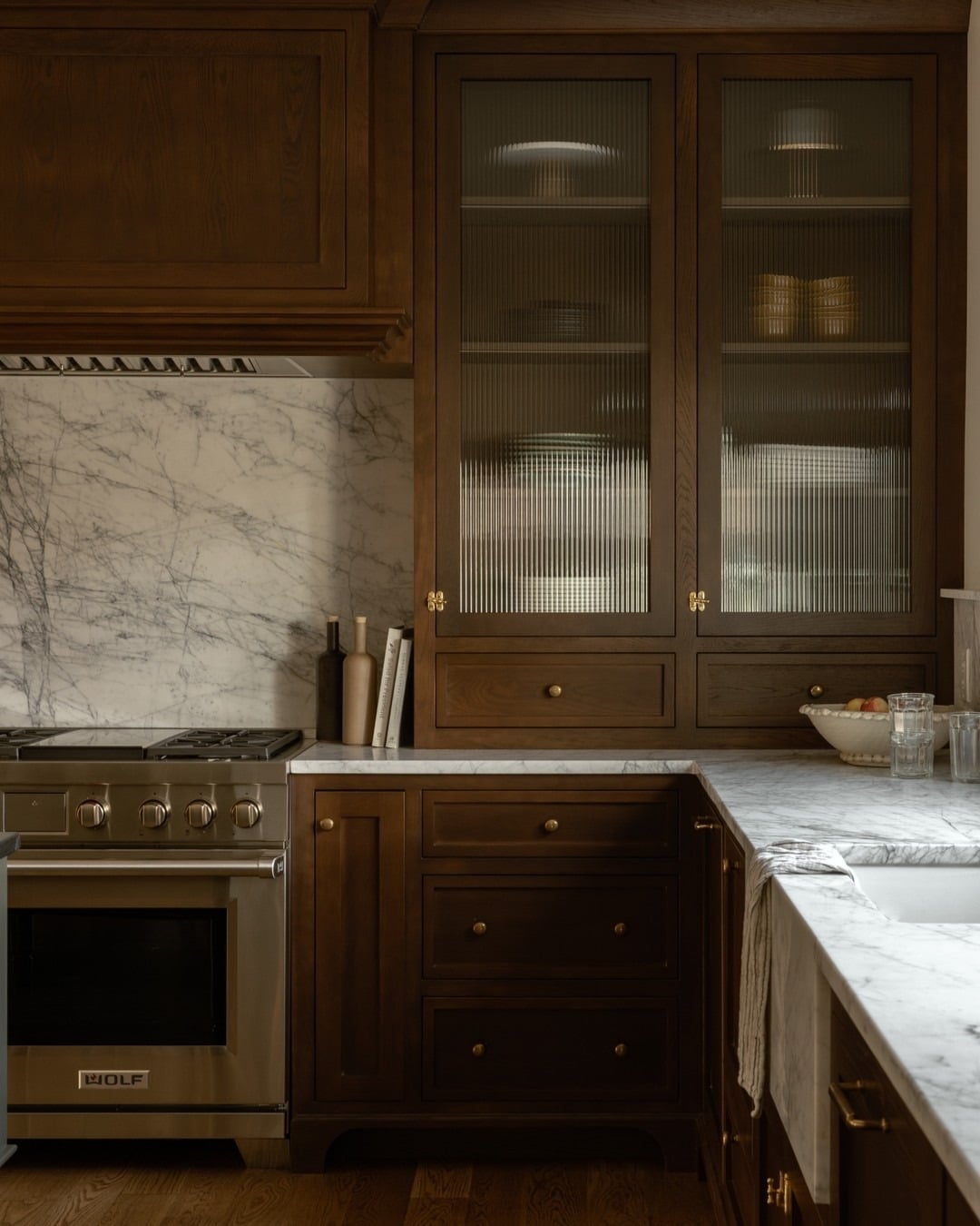 9. Traditional Brown Cabinets with Marble Backsplash - brown kitchen cabinets ideas