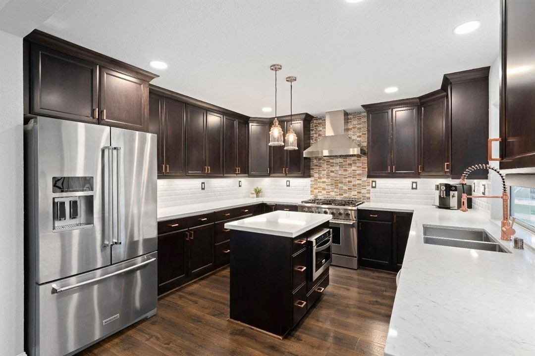 15. Rich Cocoa Cabinets with Copper Hardware Accents - brown kitchen cabinets ideas