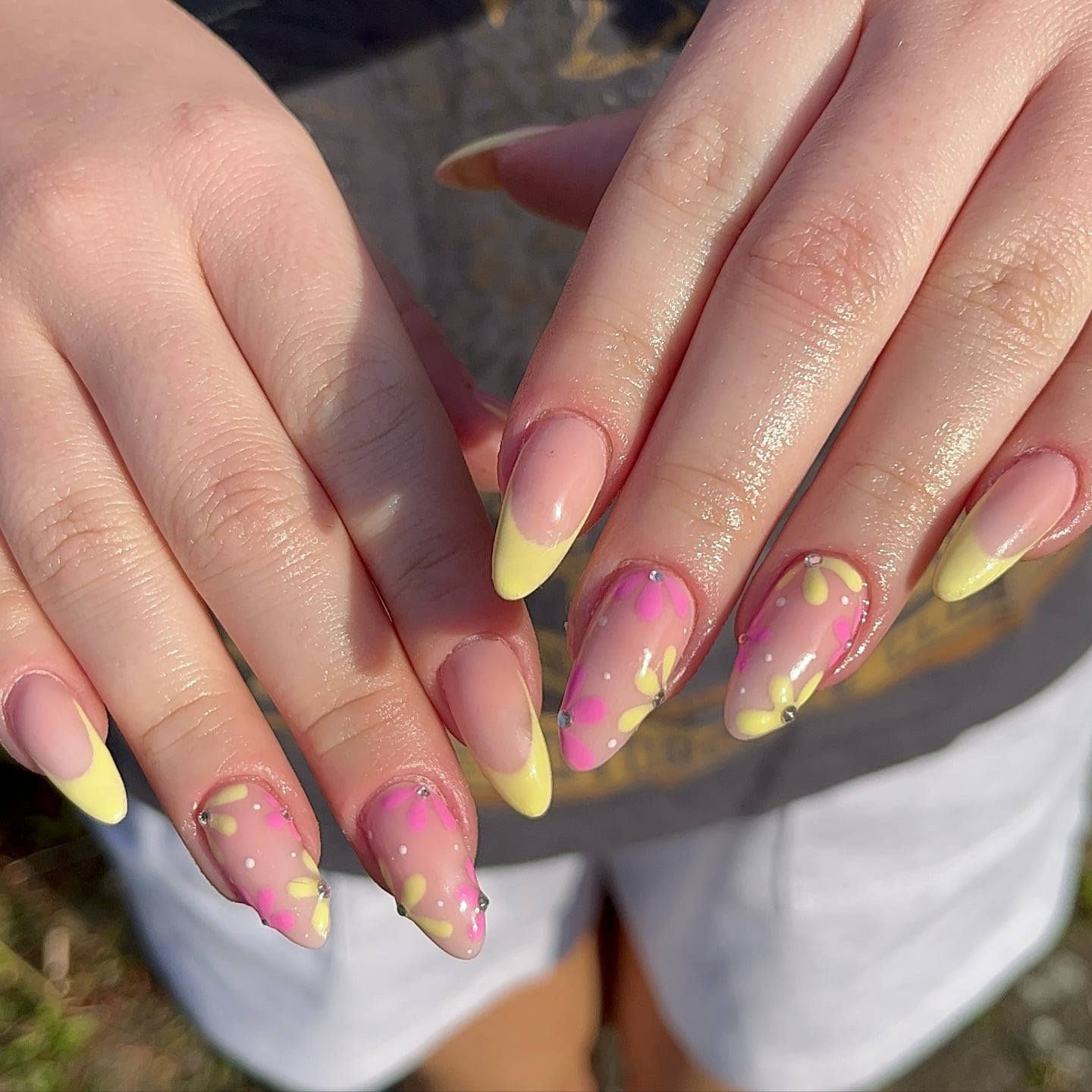 5. Matte Nude Almond French with Neon Floral Overlay - french tip flower nail ideas