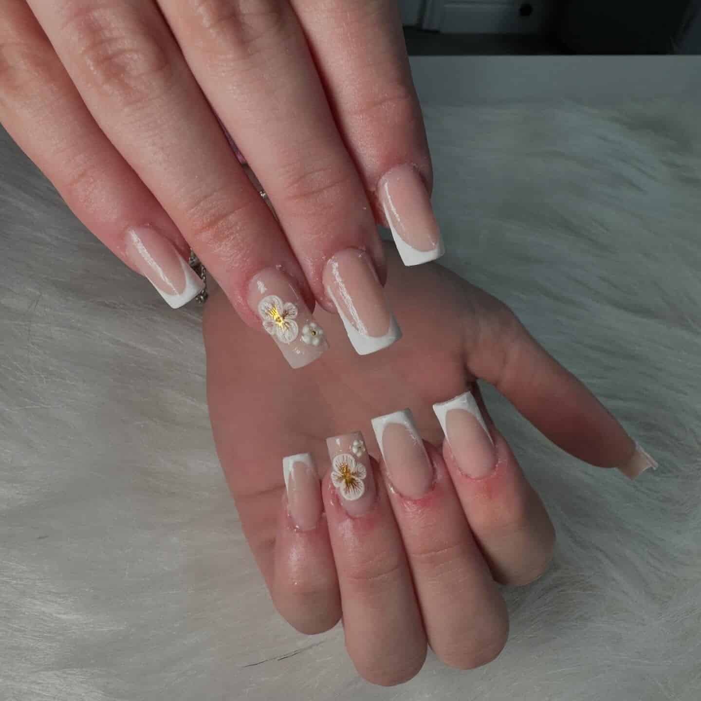 10. Nude Square French with White Floral Embellishment - french tip flower nail ideas