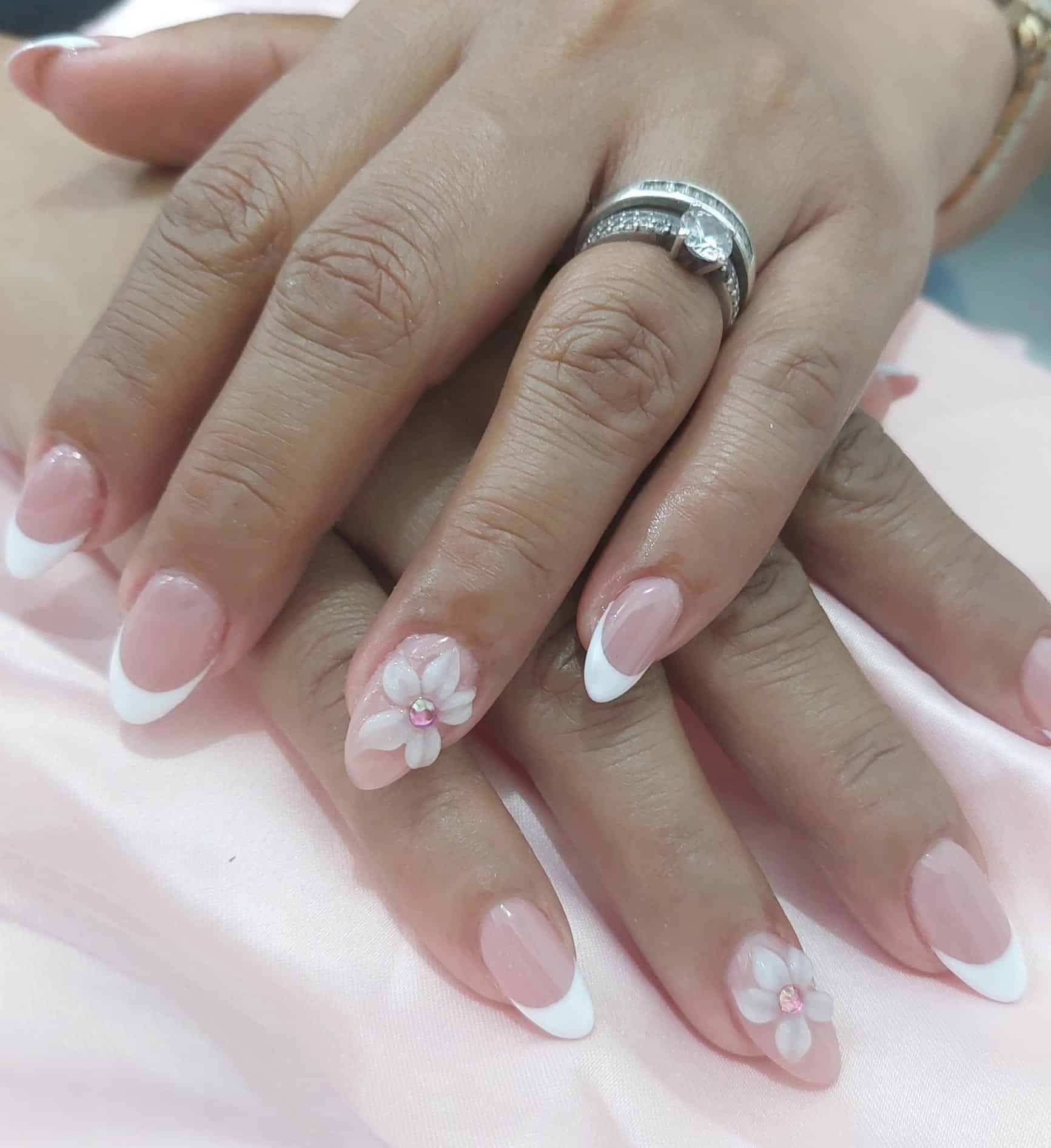 14. Soft Pink Almond French with 3D Blossom Accent - french tip flower nail ideas