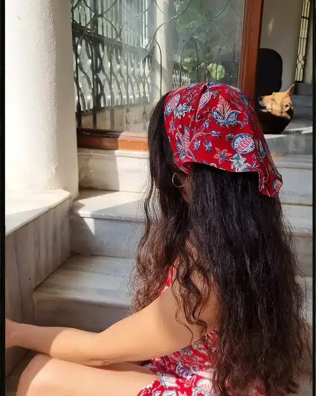 6. Natural Dark Curls with Red Paisley Bandana - Bandana Hairstyles