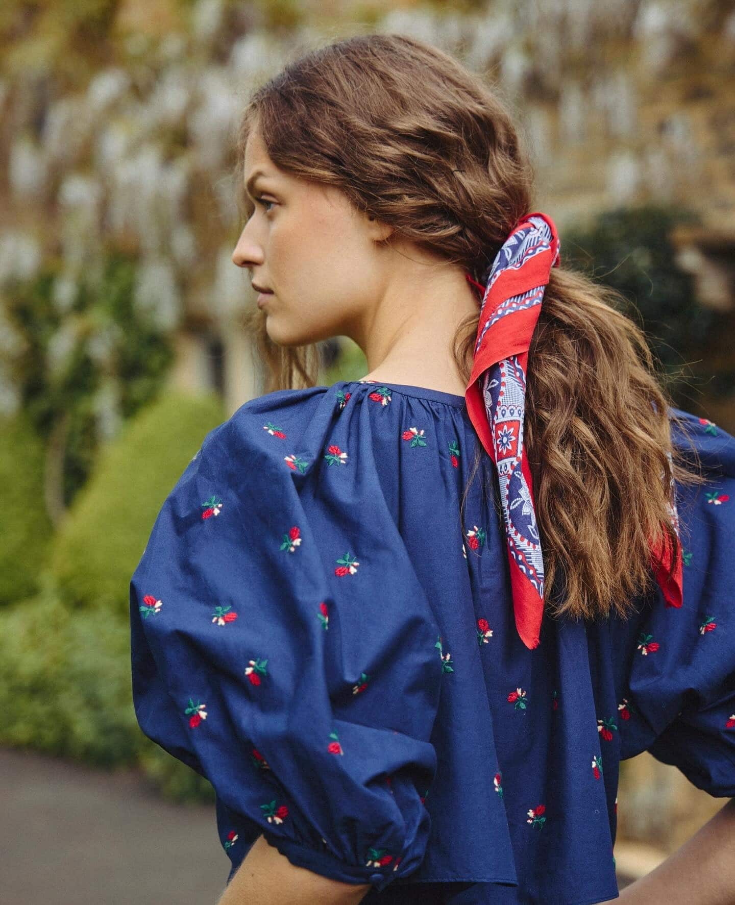 12. Warm Brown Low Ponytail with Red Paisley Scarf - Bandana Hairstyles