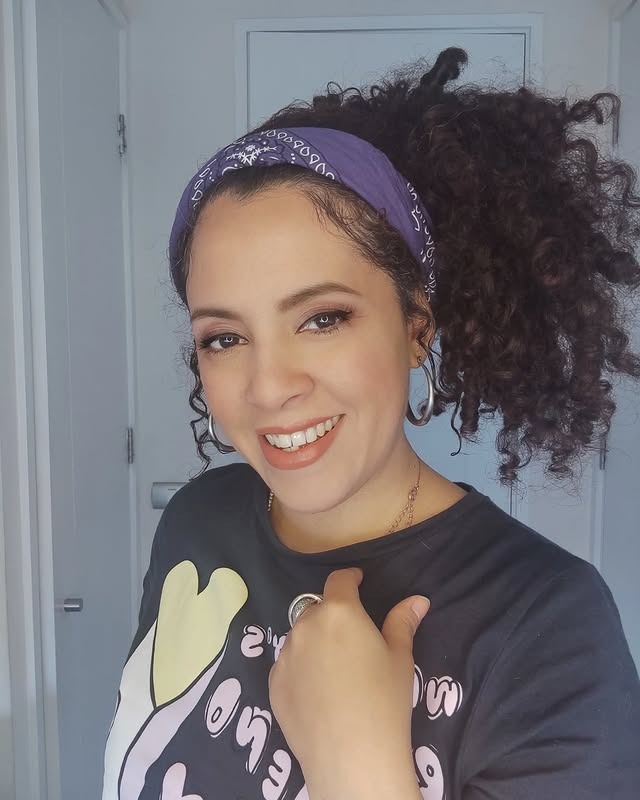 13. Natural Black Curly Ponytail with Purple Bandana - Bandana Hairstyles