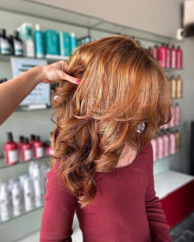 3. Voluminous Copper Layered Blowout - 90S Hairstyles