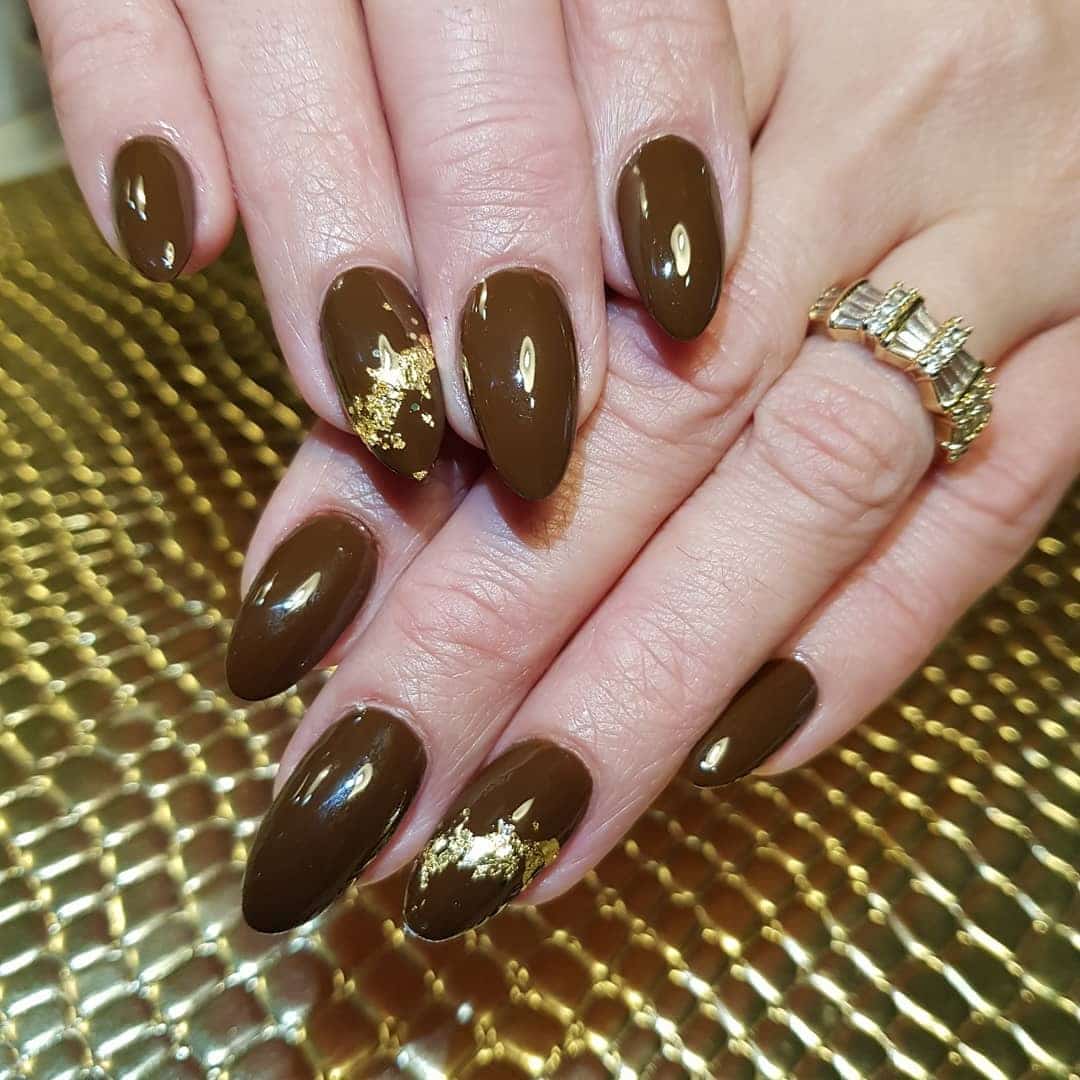 4. Deep Mocha Almond Nails with Gold Leaf Accents - gold and brown nail ideas