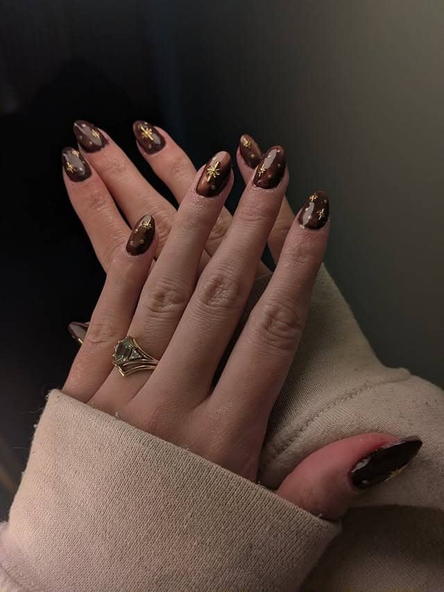 5. Chocolate Brown Short Almond Nails with Gold Celestial Art - gold and brown nail ideas
