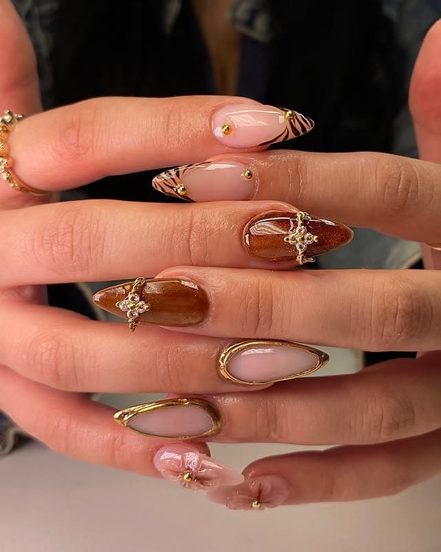 13. Caramel Chrome Almond Nails with Gold Framing and Crystal Embellishments - gold and brown nail ideas