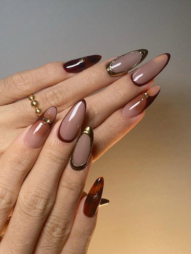 16. Taupe and Chocolate Almond Nails with Gold Outline Detailing - gold and brown nail ideas