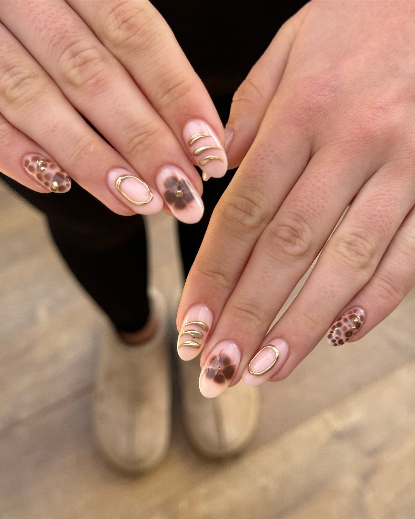 20. Soft Pink Almond Nails with Brown Floral and Gold Outline Art - gold and brown nail ideas