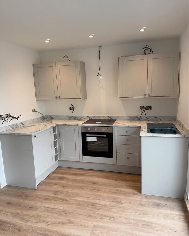 2. Compact Soft Gray L-Shaped Garage Kitchen - garage kitchen ideas