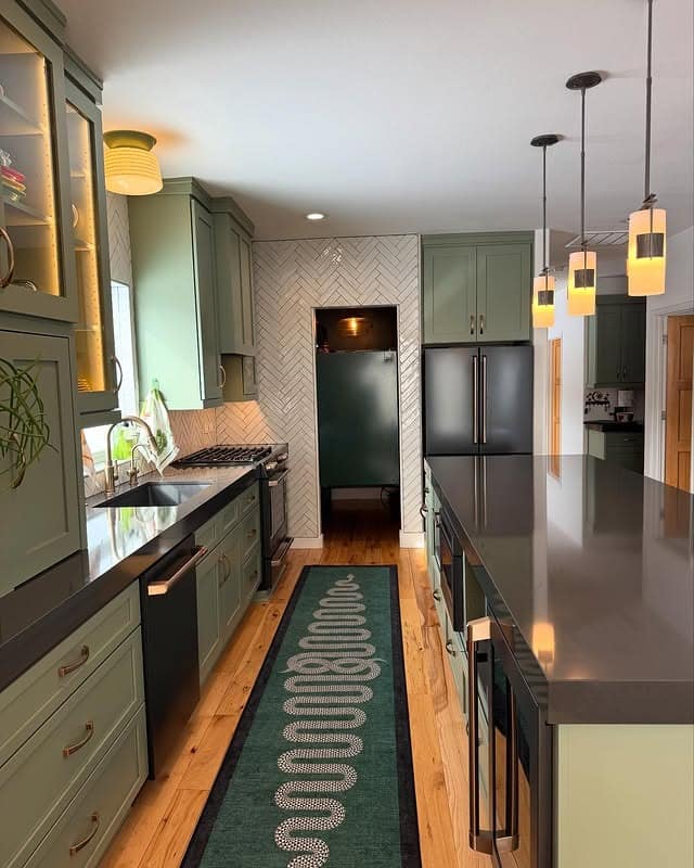 3. Sage Green Galley Garage Kitchen with Herringbone Detail - garage kitchen ideas