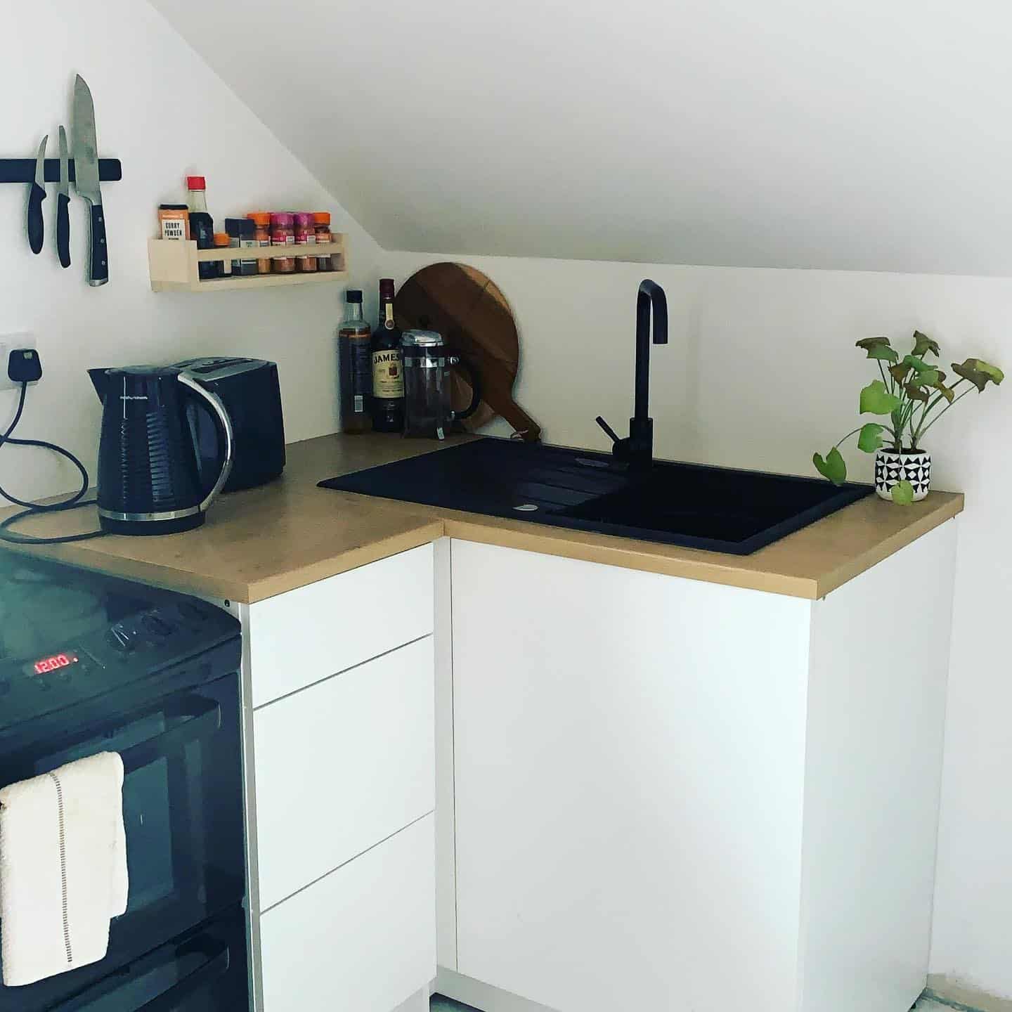 14. Compact Contemporary Garage Kitchen in White and Black - garage kitchen ideas