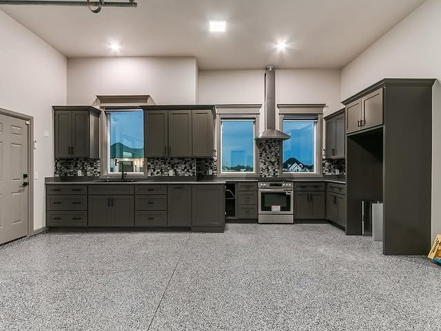 22. Charcoal Gray Garage Kitchen with Speckled Epoxy Flooring - garage kitchen ideas