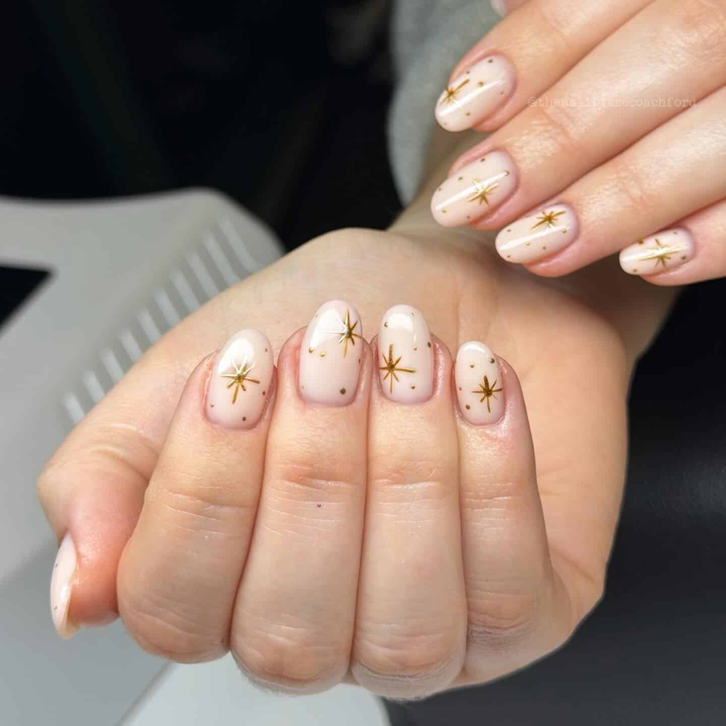 1. Milky Blush Almond Nails with Gold Star Chrome Accents - gold chrome nail ideas