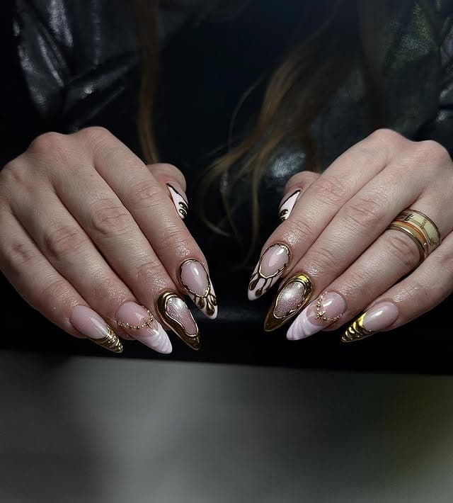 2. Nude Sculpted Stiletto Nails with Gold Chrome Framing - gold chrome nail ideas