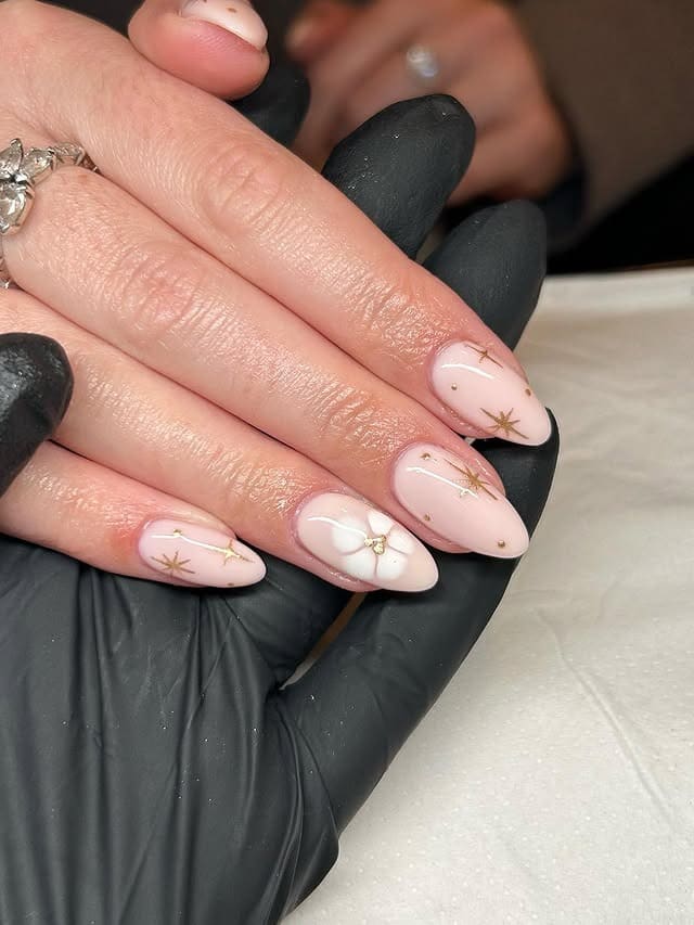 3. Soft Pink Almond Nails with Gold Star Detailing - gold chrome nail ideas