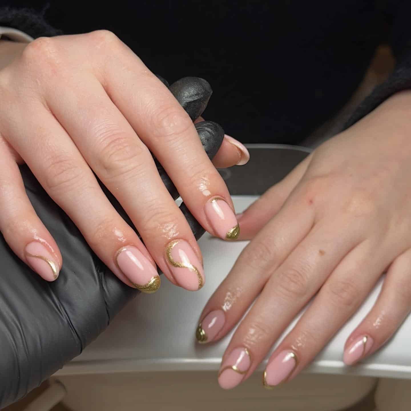5. Blush Oval Nails with Gold Chrome French Tips - gold chrome nail ideas