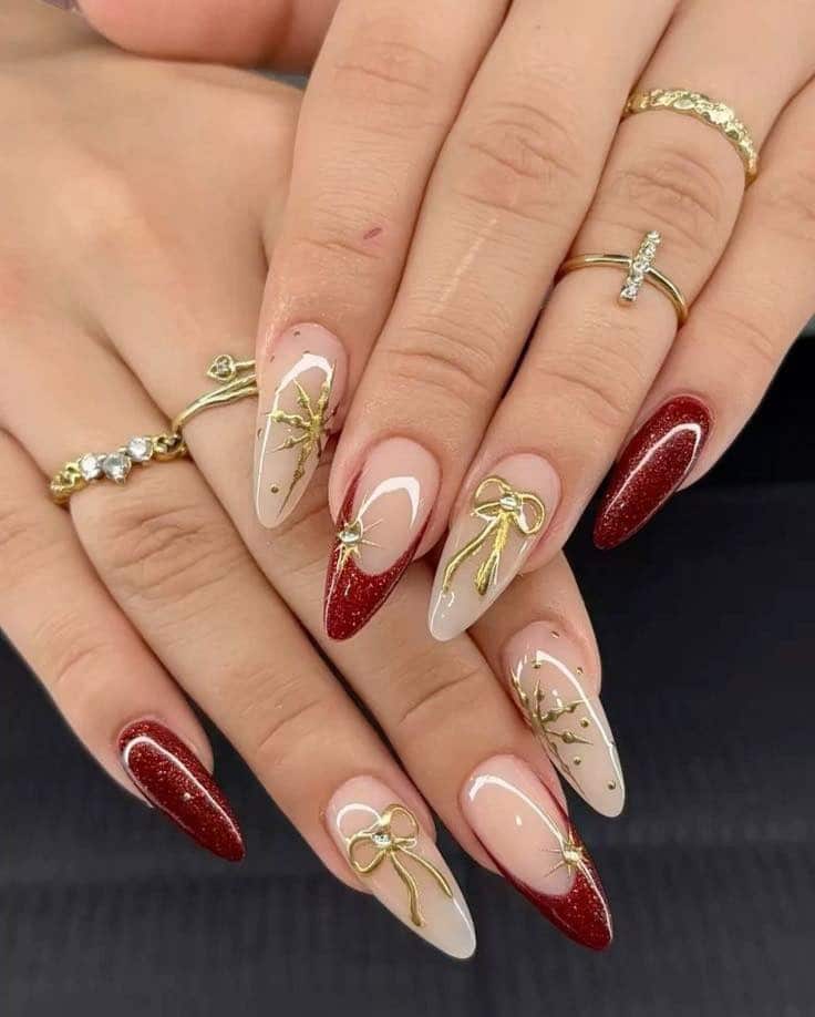 7. Red Glitter and Nude Almond Nails with Gold Bow Art - gold chrome nail ideas