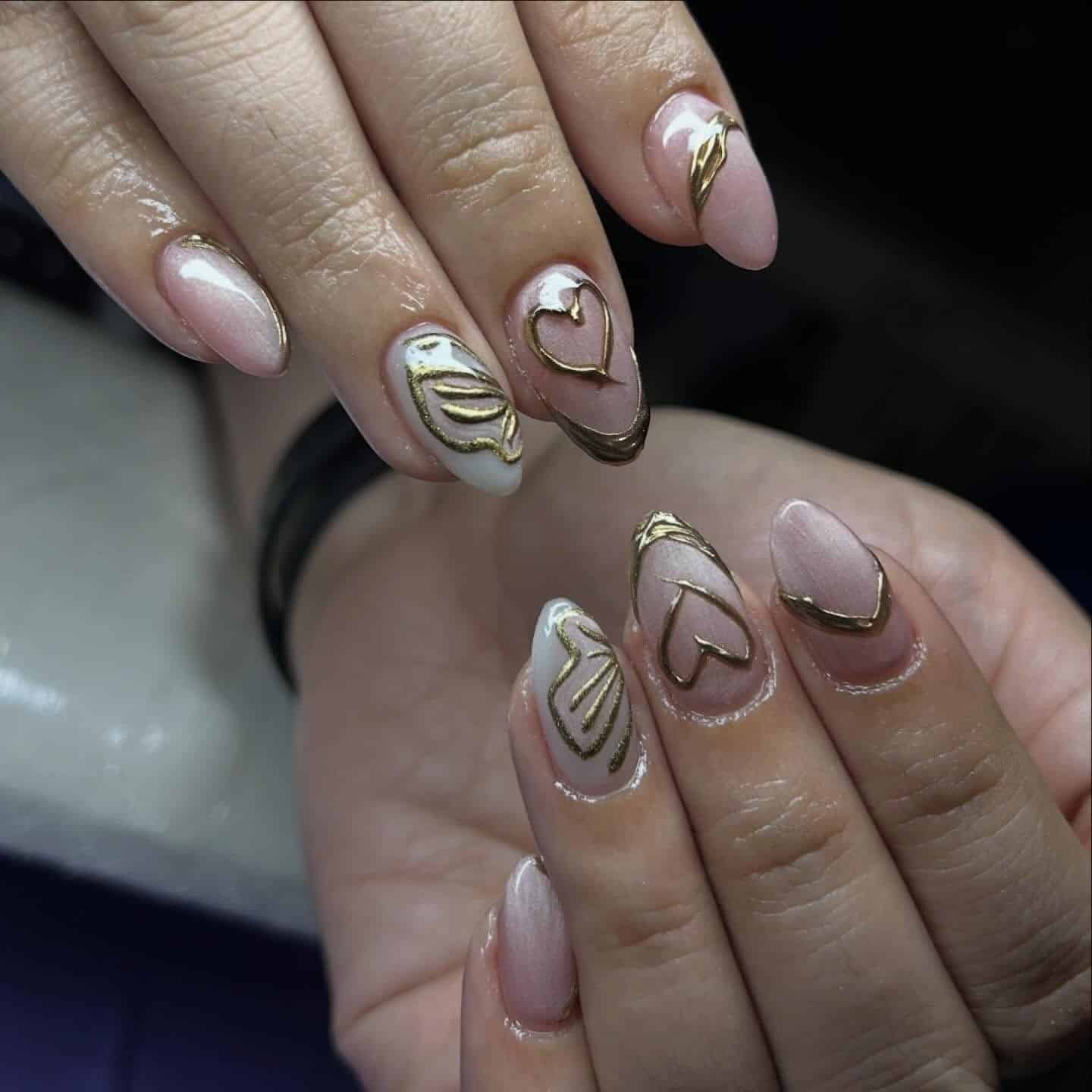 19. Blush and Pearl Almond Nails with Gold Chrome Hearts - gold chrome nail ideas