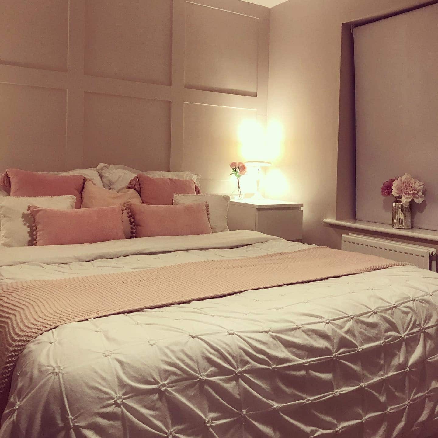 21. Mauve Panel Wall with Blush and White Layered Bedding - pink and white bedroom ideas