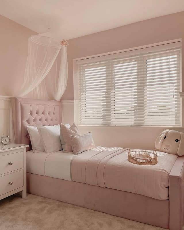 22. Blush Upholstered Bed with White Wainscoting and Sheer Canopy - pink and white bedroom ideas