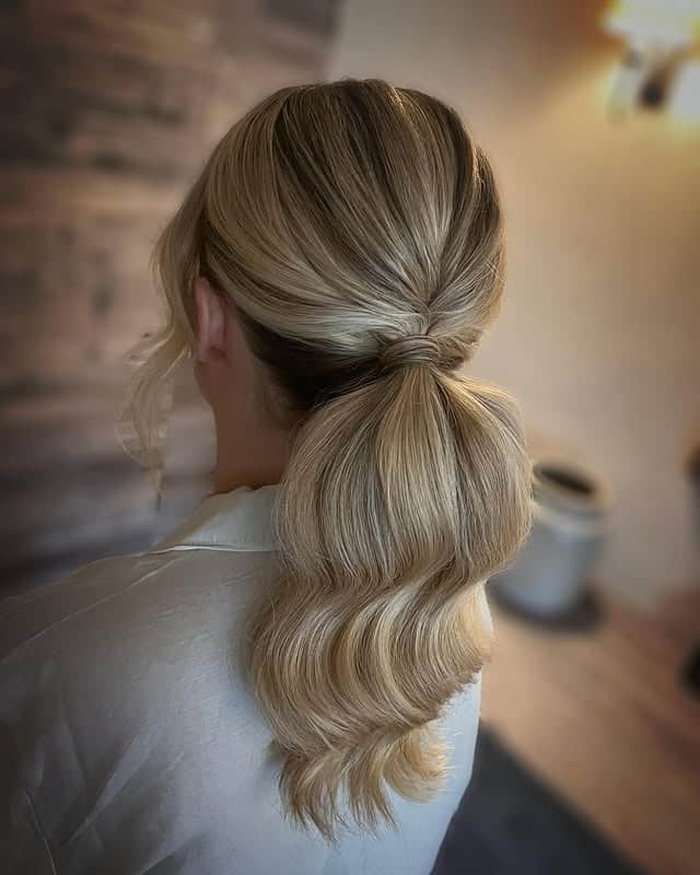 6. Sleek Low Ponytail with Creamy Blonde Blend - Bridesmaid Hairstyles