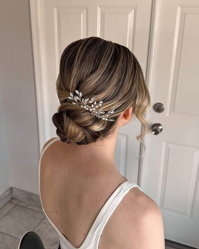 7. Braided Crown Low Bun with Ash Blonde Dimension - Bridesmaid Hairstyles