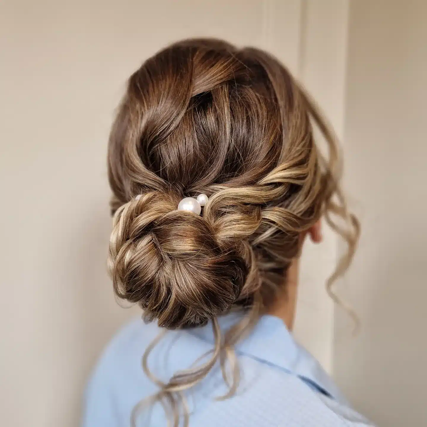 16. Twisted Low Bun with Dimensional Bronde and Pearl Accent - Bridesmaid Hairstyles