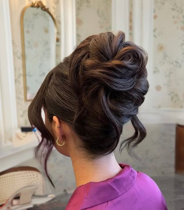 19. Voluminous High Bun with Dark Chocolate Brown - Bridesmaid Hairstyles