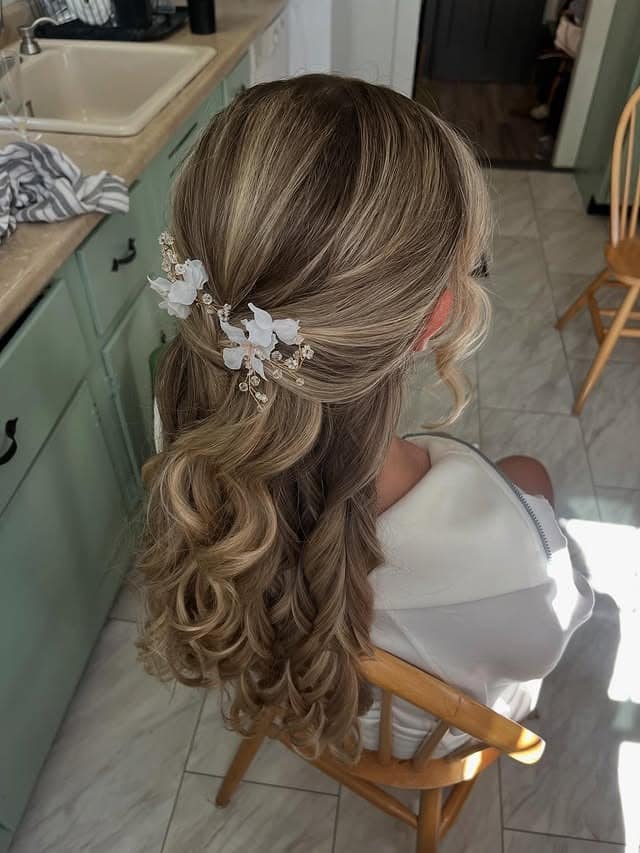 20. Low Ponytail with Ash Bronde and Floral Hairpiece - Bridesmaid Hairstyles