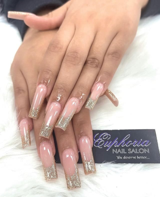 10. Glossy Dark Brunette Hair with Gold Glitter French Coffin Nails - gold glitter nail ideas